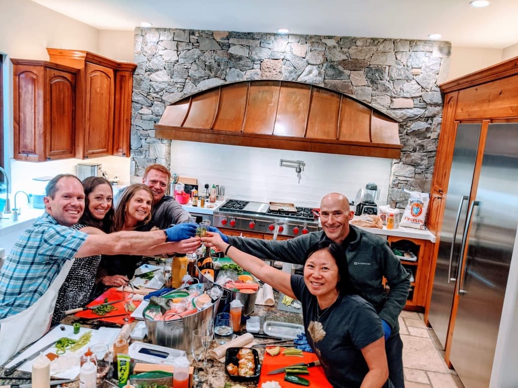 Guests learning to roll sushi in a hands-on class