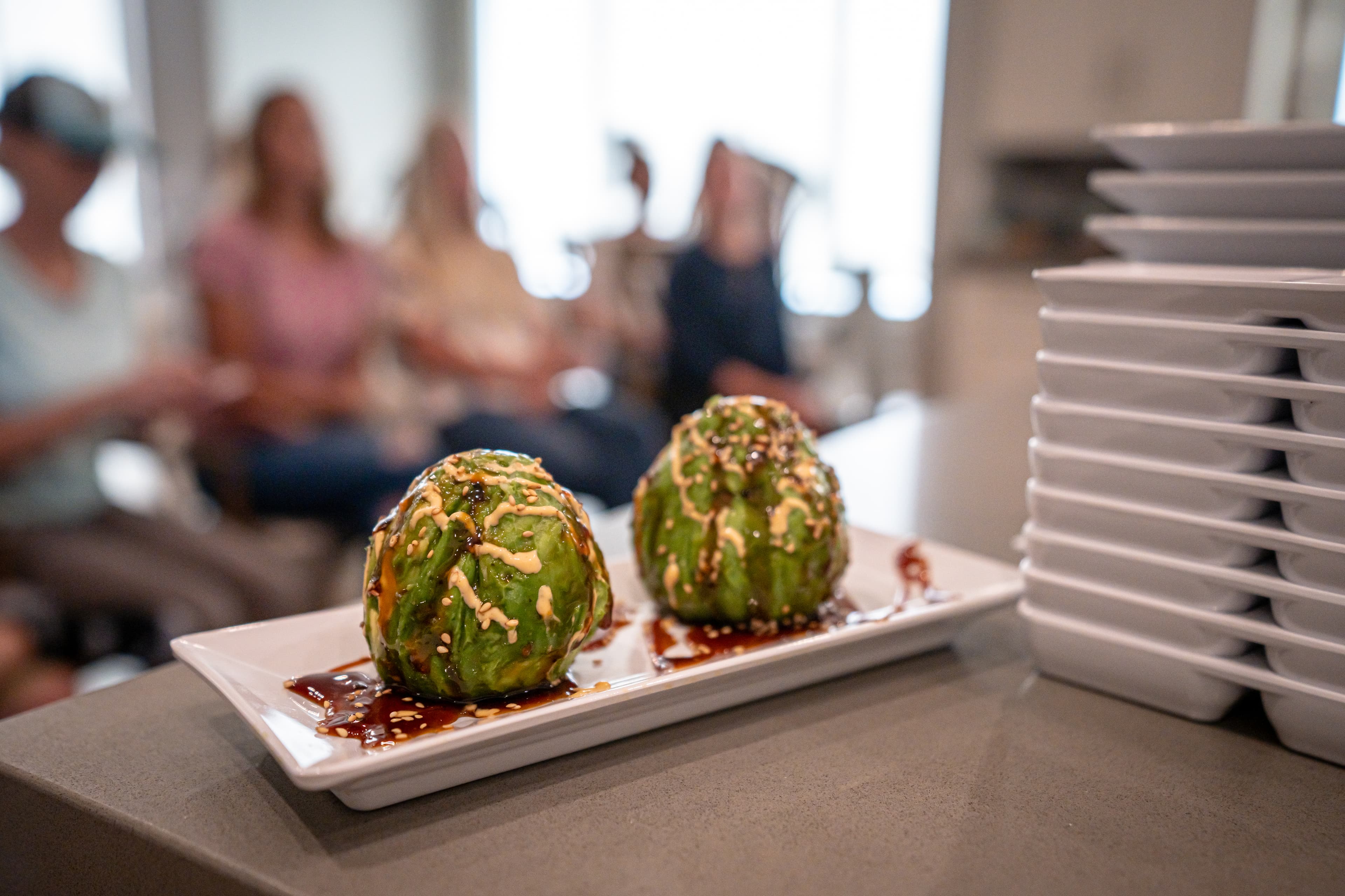 Hands-on sushi class with guests rolling sushi together
