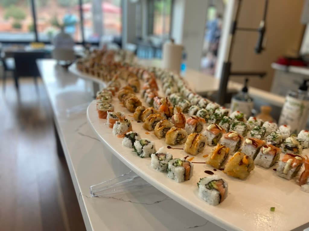Close-up of sushi rolls flowing on the river table